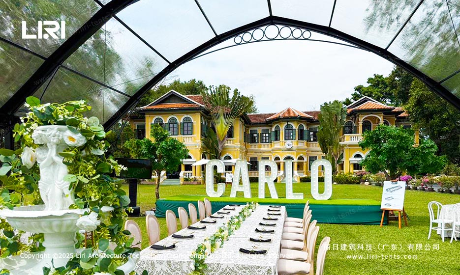 Orangery tent dining layout in a garden venue