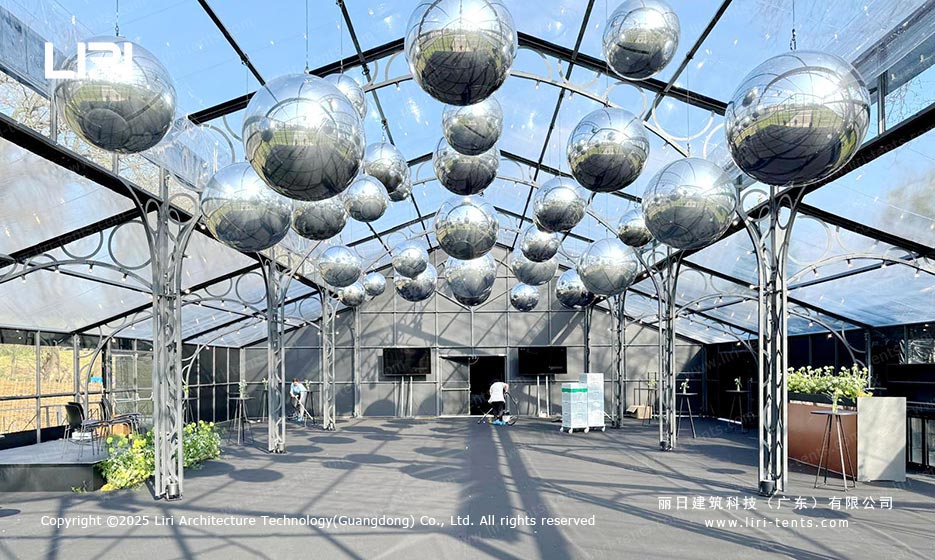 Orangery tent business event interior with mirrored decor and open layout