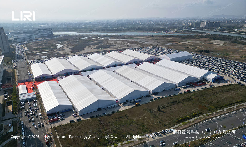 Aerial view of a large aluminum structure exhibition tent complex hosting a global expo