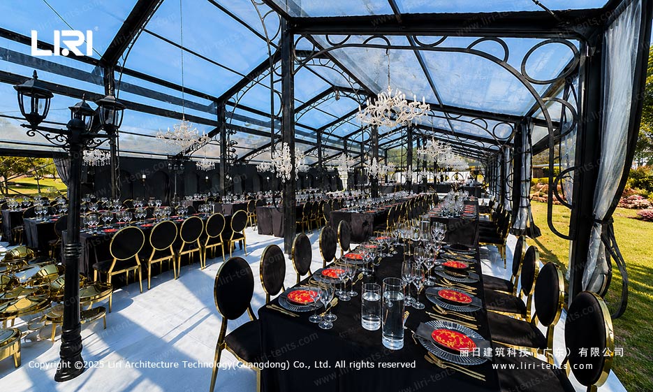 Orangery tent banquet interior with glass walls curtains and dining tables