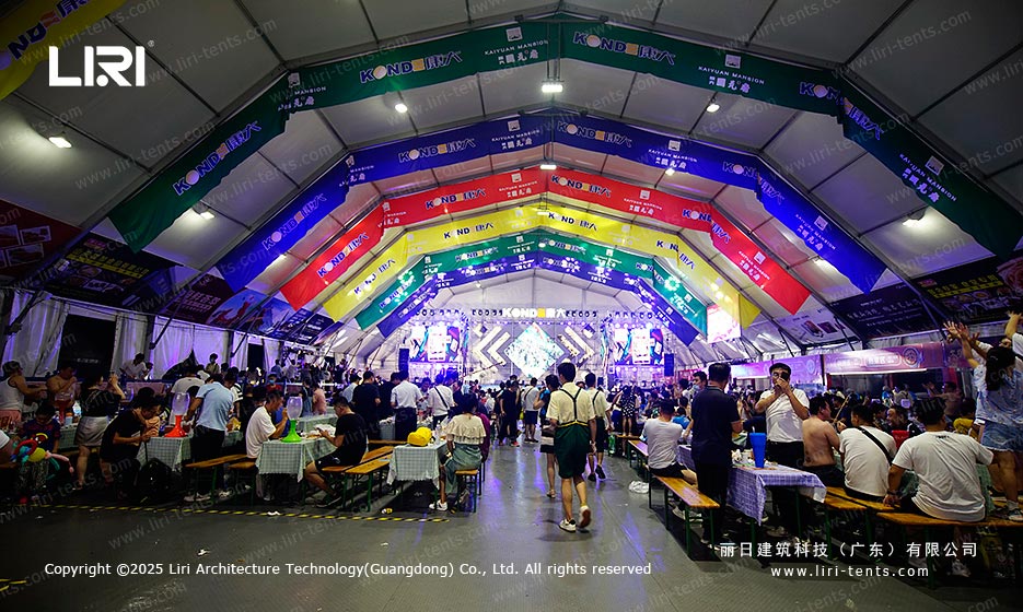Beer festival tent interior layout with stage lighting and dining tables