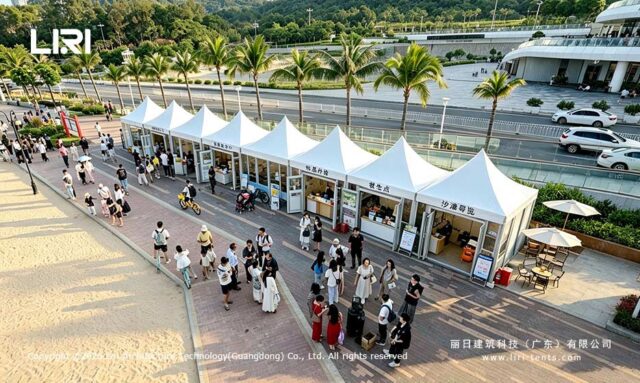 Connected modular pagoda shops along a palm lined promenade