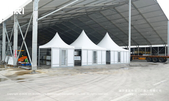 Three modular pagoda tents with panel walls and glass doors